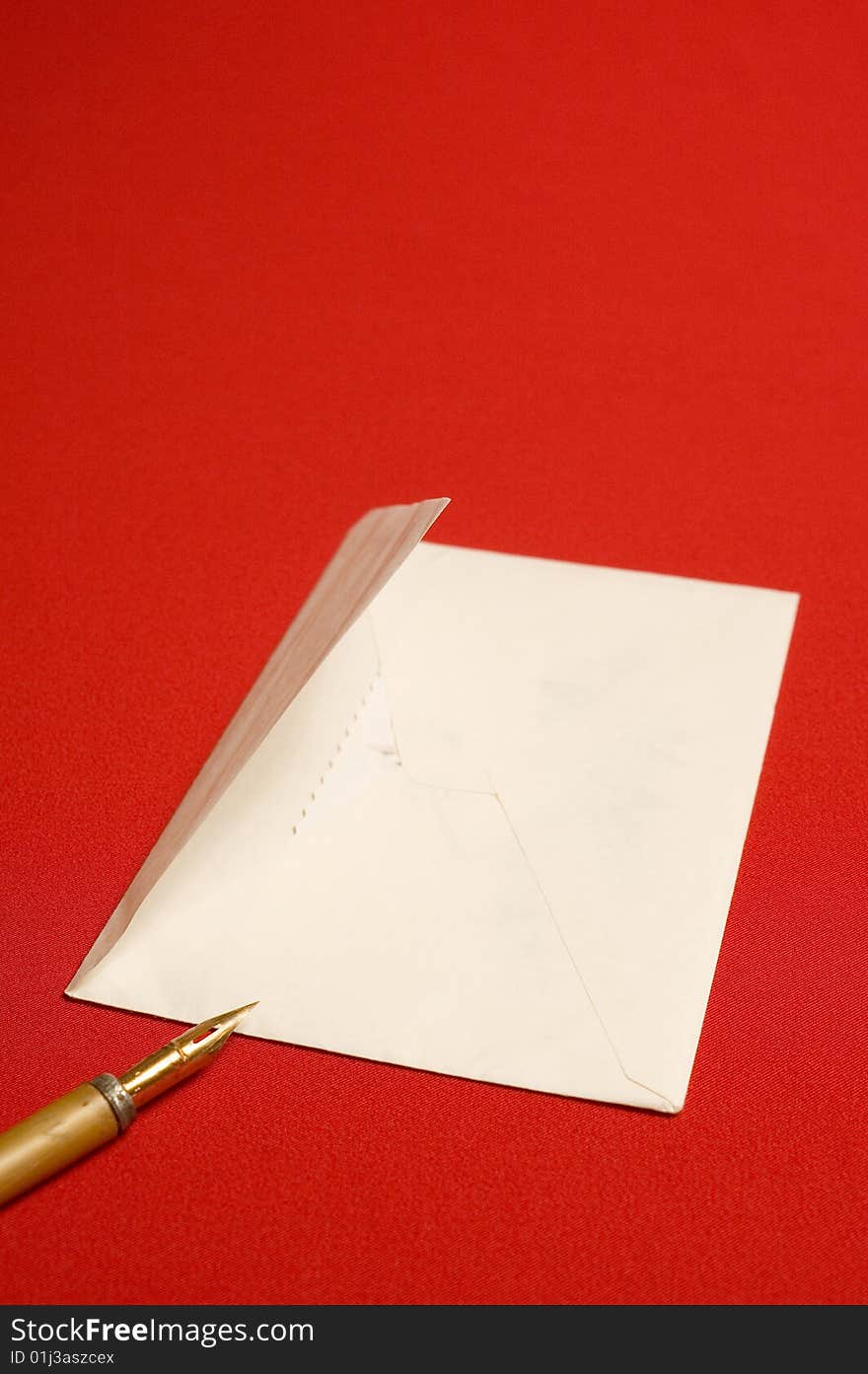 Envelope and pen on red backgrounds. Envelope and pen on red backgrounds