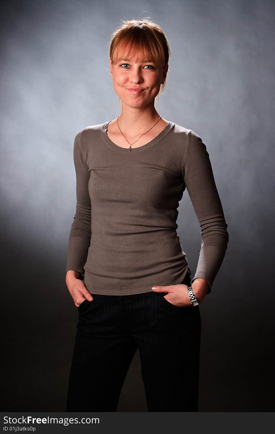 Portrait of female on a grey background in studio