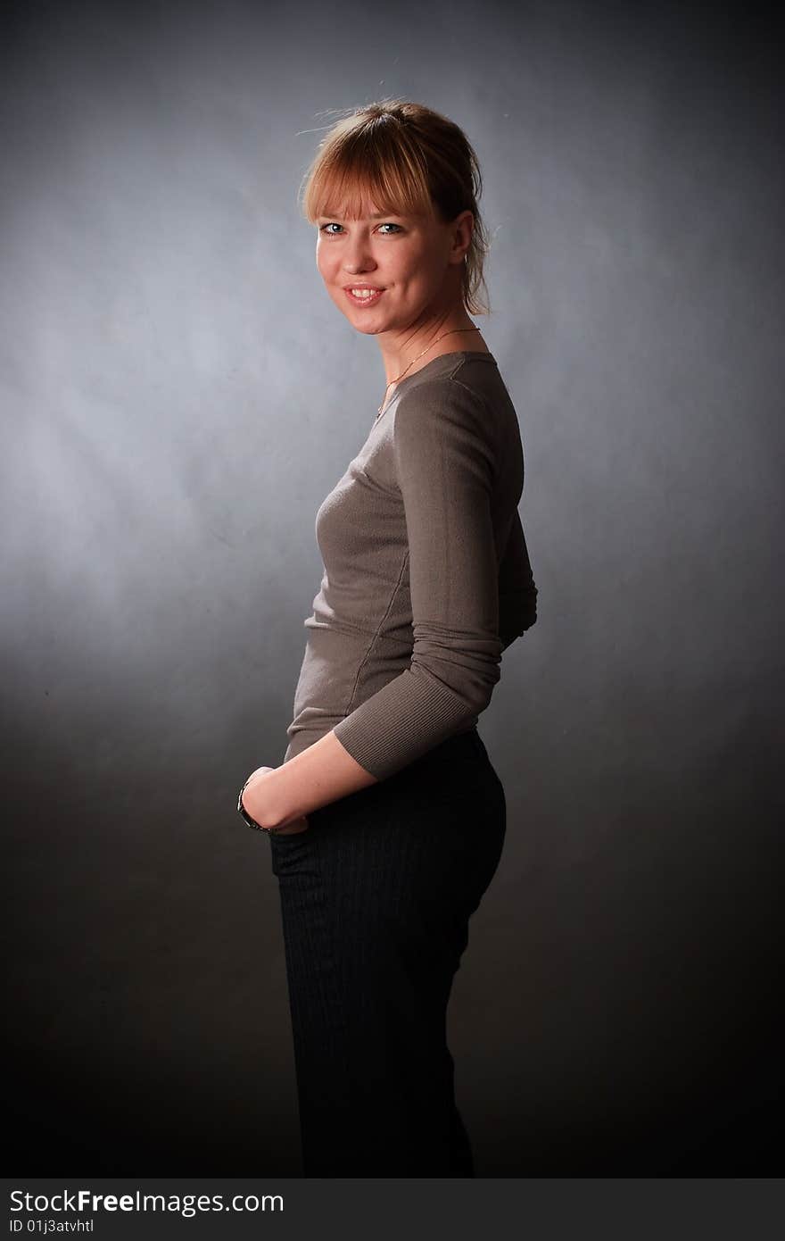 Portrait of female on a grey background in studio