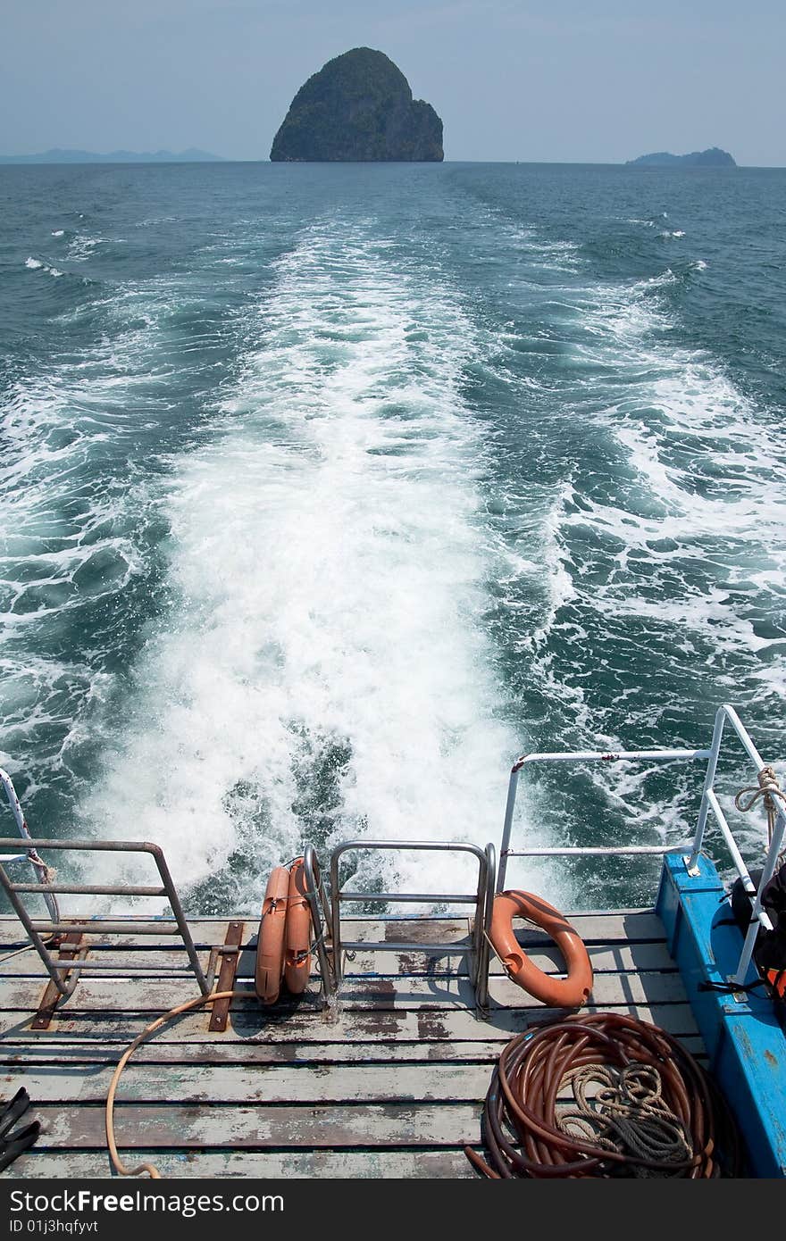 Island in sea of southern Thailand. View from back of boat. Island in sea of southern Thailand. View from back of boat.