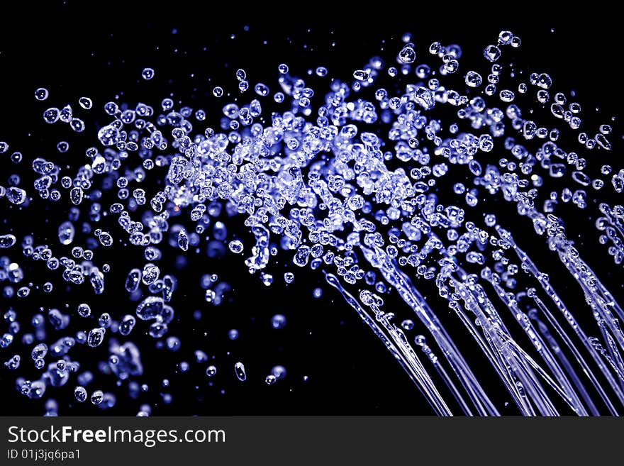 Hits drop of water on black background