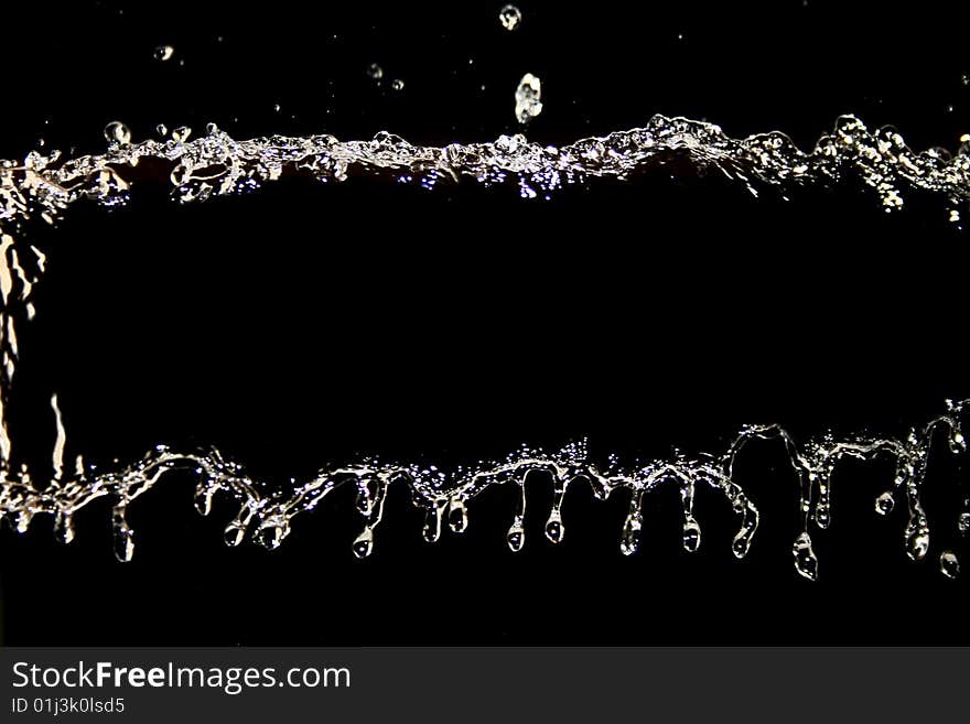 Hits drop of water on black background