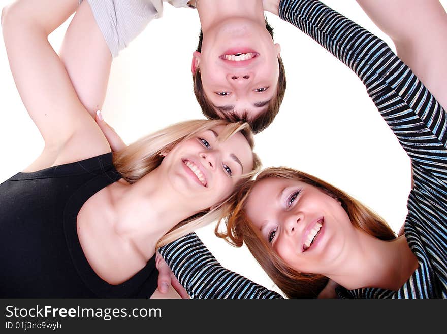 Three happy young friends at white background. Three happy young friends at white background