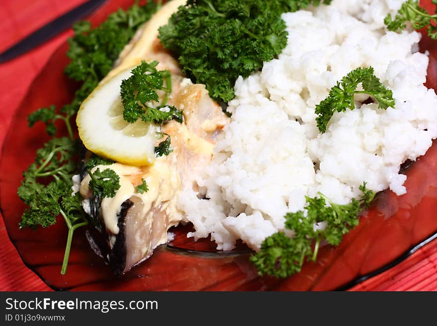 Plate with slice of salmon and rice. Plate with slice of salmon and rice