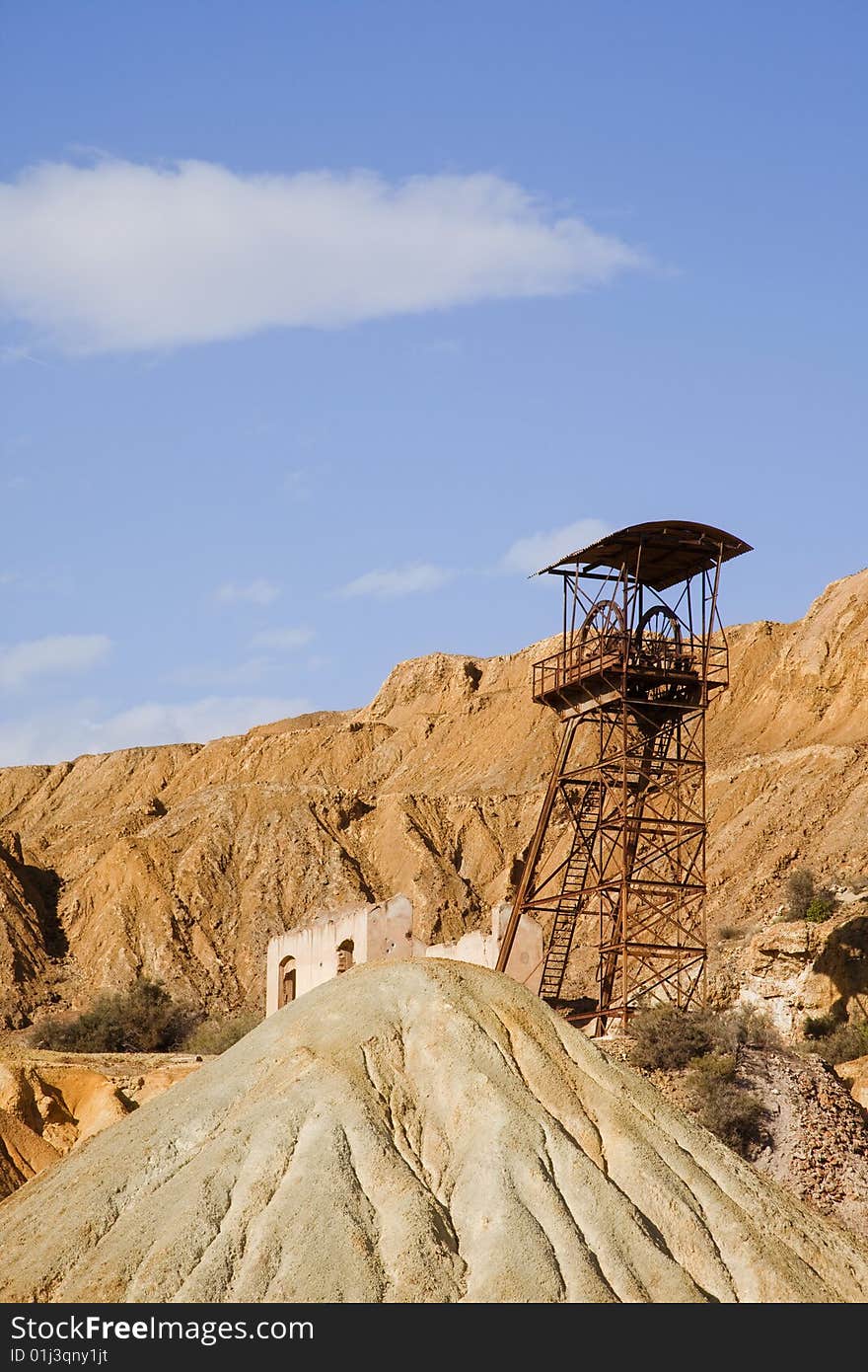 Abandoned old mining machinery in desert.