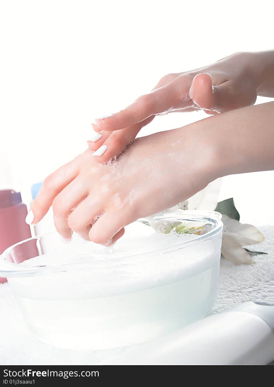 Foam of soap and female hands. Foam of soap and female hands