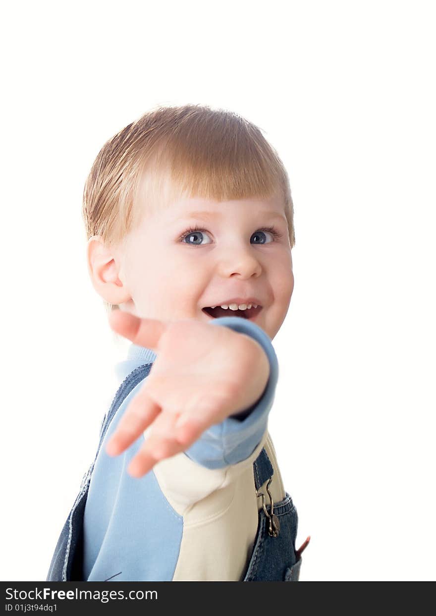 The child laughs at a white background