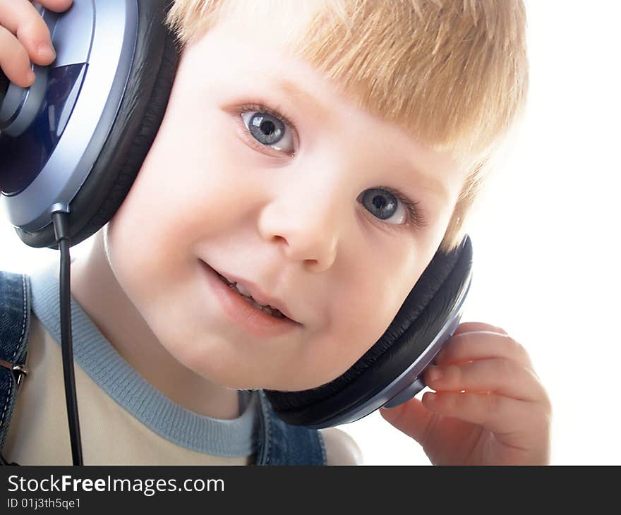 Portrait of the beautiful child in headphones. Portrait of the beautiful child in headphones