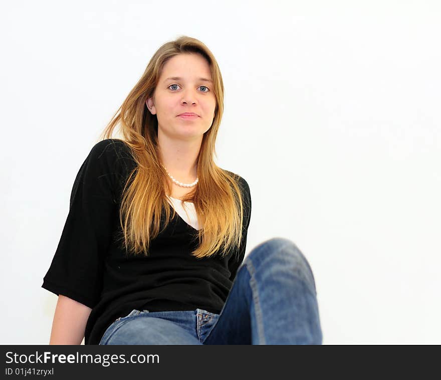 Attractive red head girl on white background in jeans and black shirt. Attractive red head girl on white background in jeans and black shirt