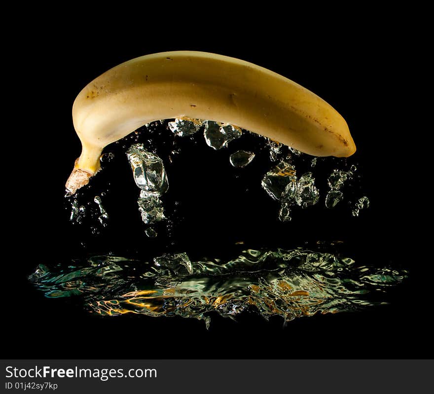 Banana in water on a black background