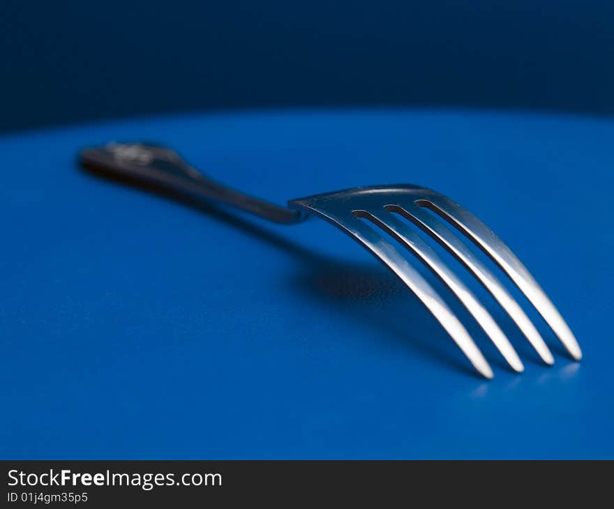 Still fork on a blue background