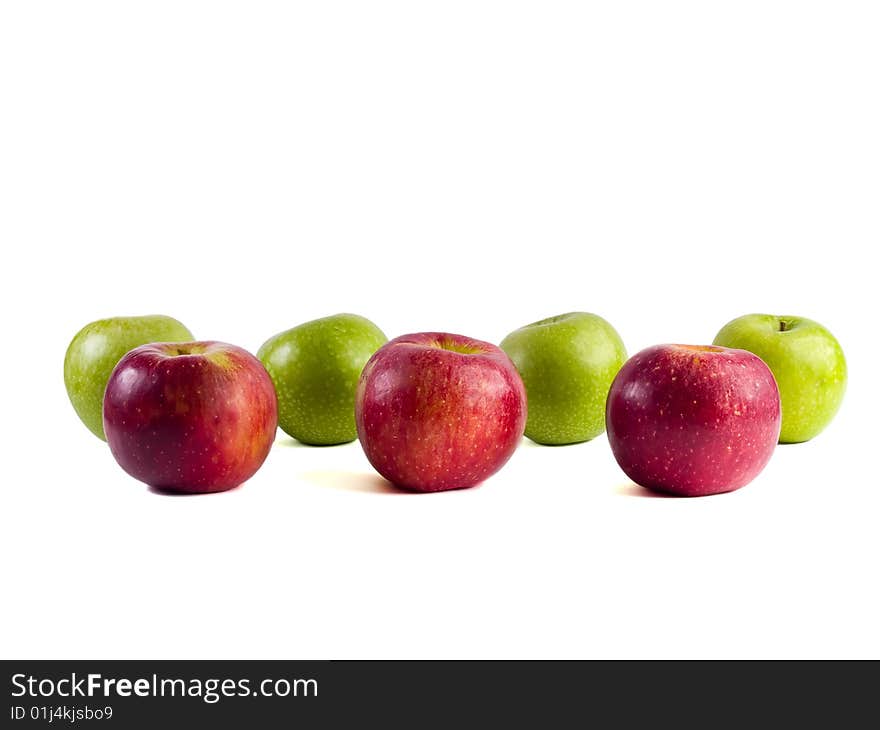 Seven red and green apples on a white background. Seven red and green apples on a white background