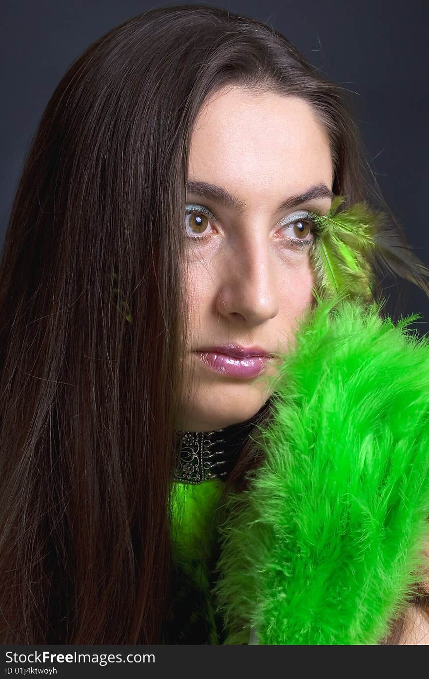 Portrait attractive young woman with green fan, vertical. Portrait attractive young woman with green fan, vertical