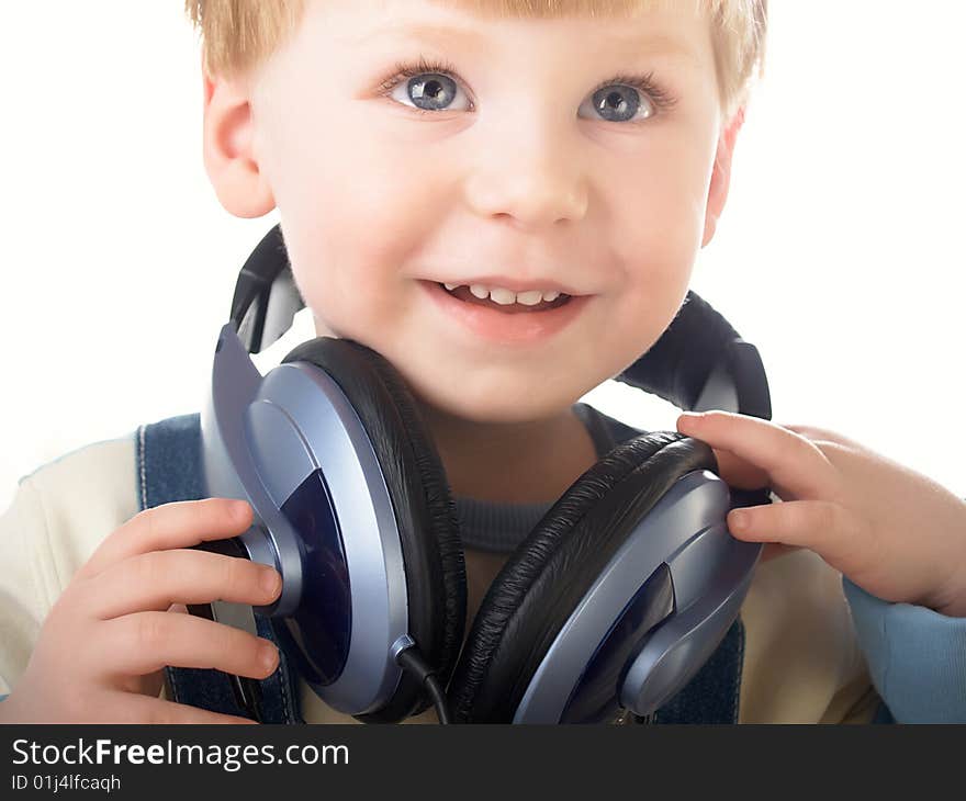 Portrait of the beautiful child in headphones. Portrait of the beautiful child in headphones