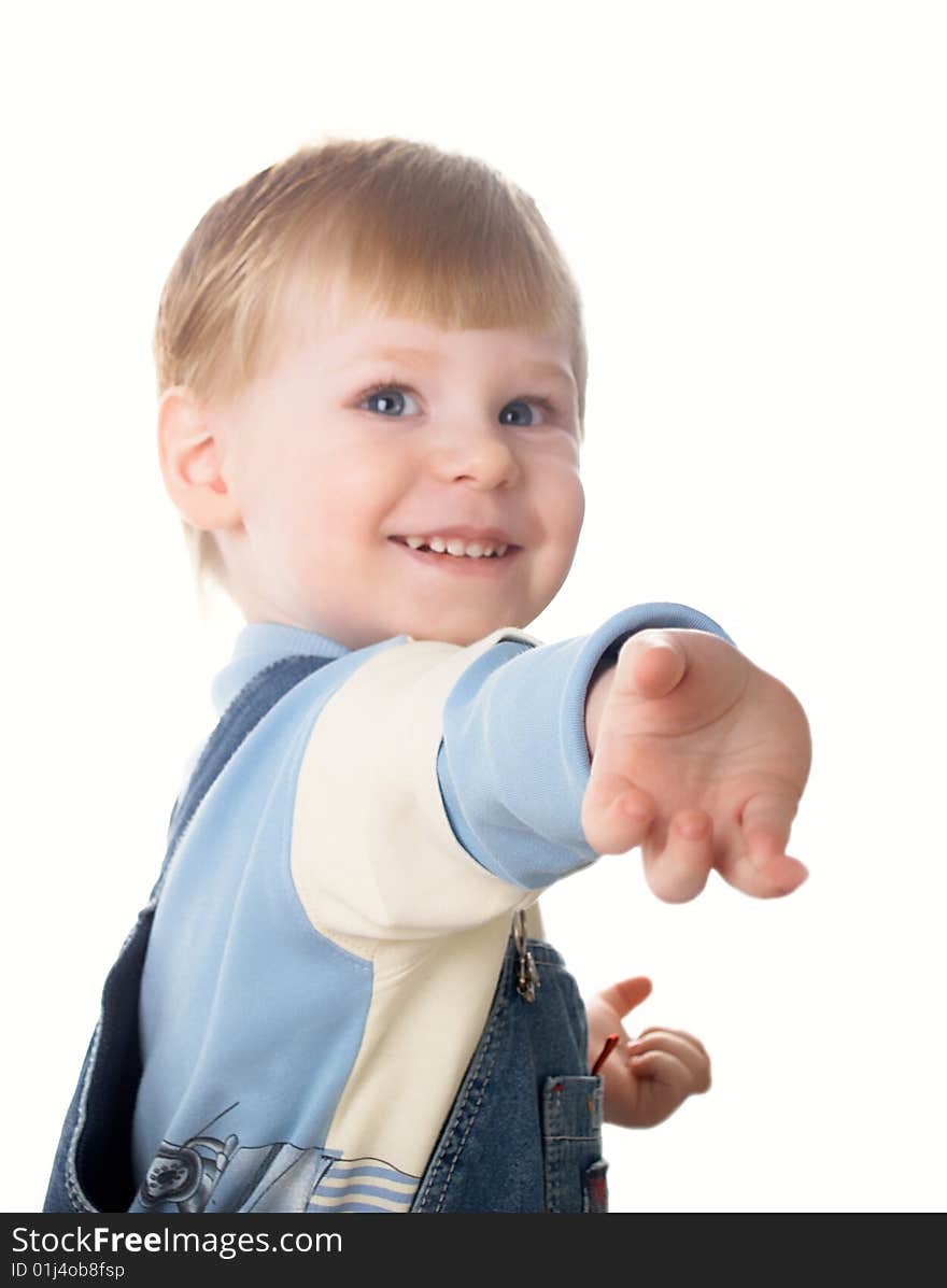 The child laughs at a white background