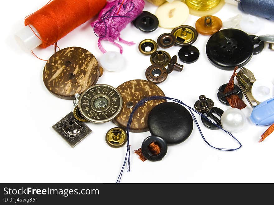 Buttons and strings close up on a white background