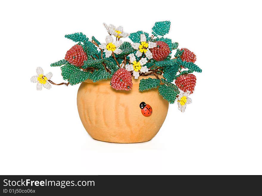 Flowers and strawberry from a bead on a white background