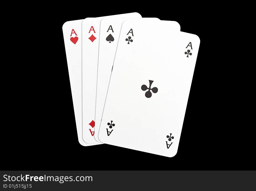 Four aces isolated on black background