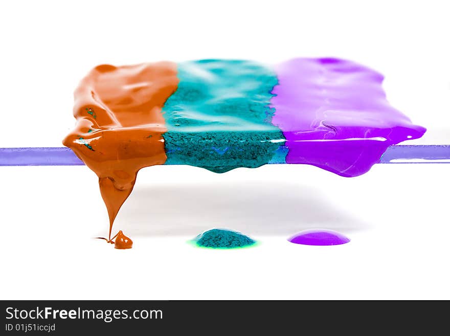 The wax of three different colours thawing and dripping