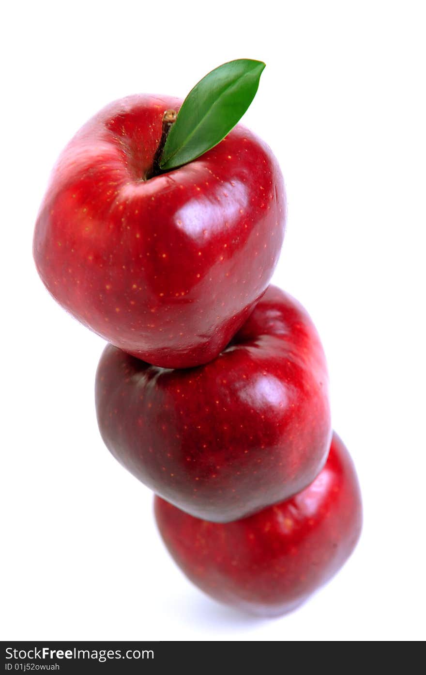 Stack of three red apple in equilibrium on white background. Stack of three red apple in equilibrium on white background