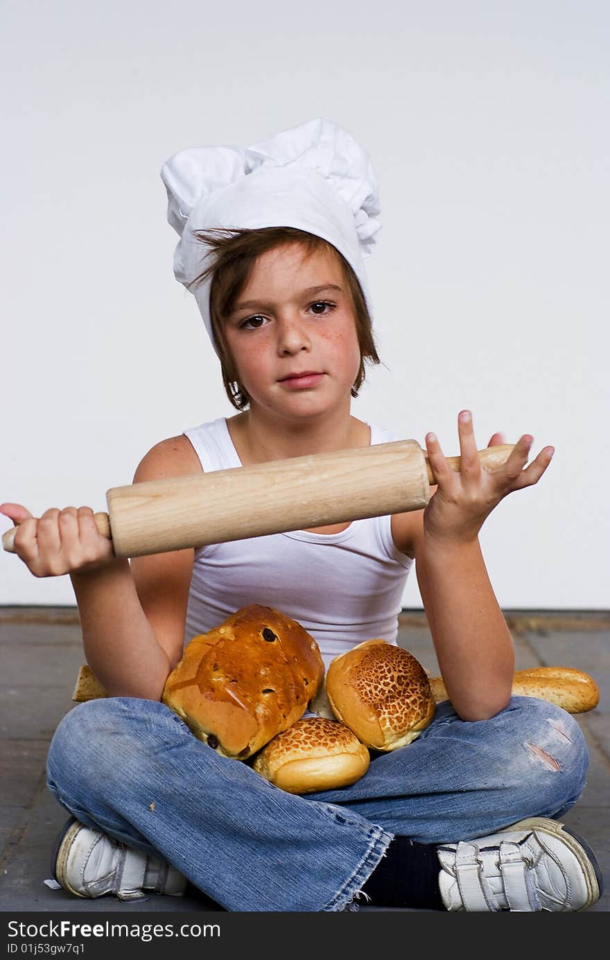 Young baker boy with bread and sandwich. Young baker boy with bread and sandwich