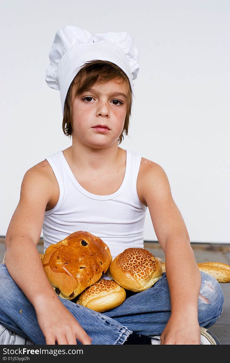 Young baker boy with bread and sandwich. Young baker boy with bread and sandwich