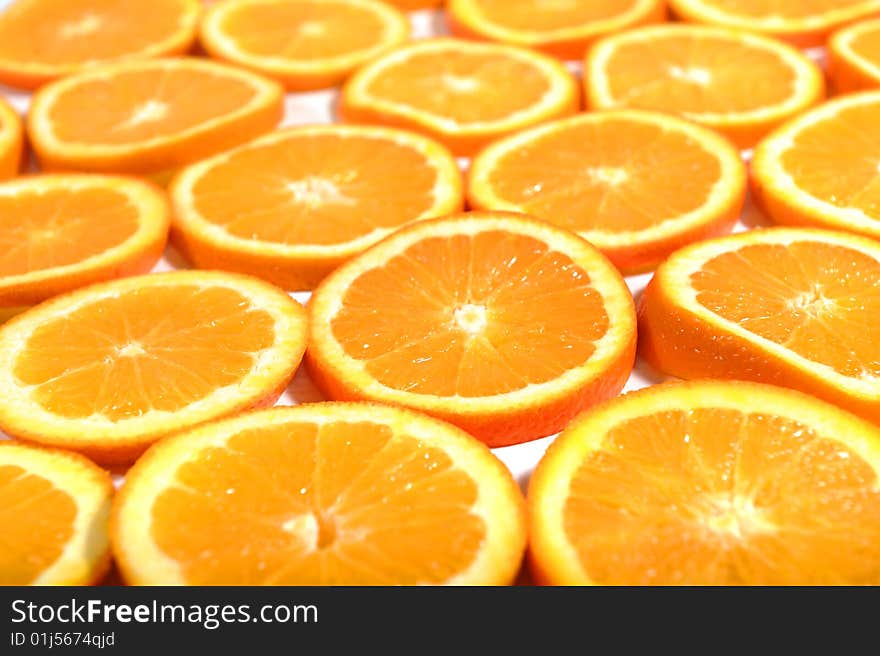 Background of orange fruits slices, selective focus. Background of orange fruits slices, selective focus