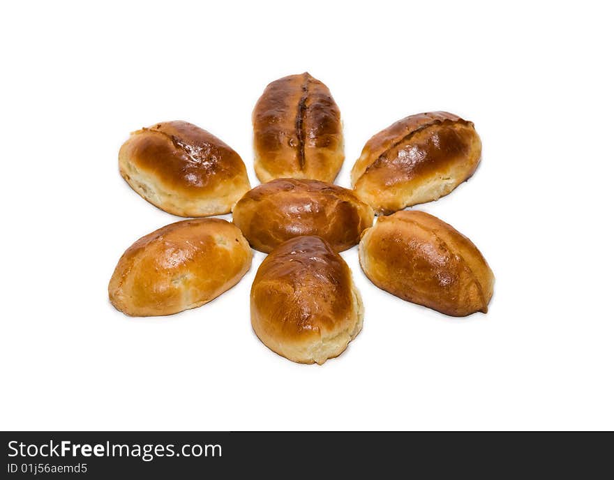 Small group of patties laid out in the form of flower on a white background