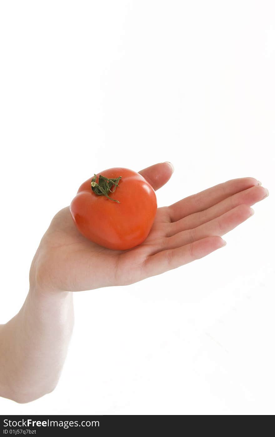 Young girl with fresh red tomato in hand. Young girl with fresh red tomato in hand.