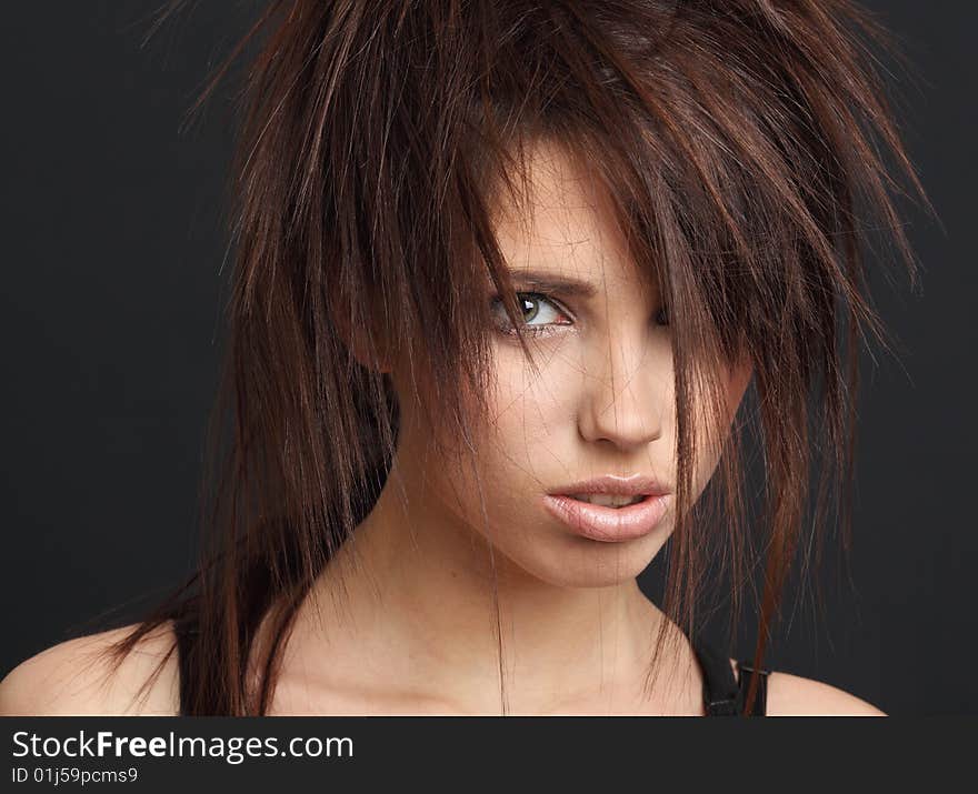 Portrait of beautiful young fashion model. black background. Portrait of beautiful young fashion model. black background.