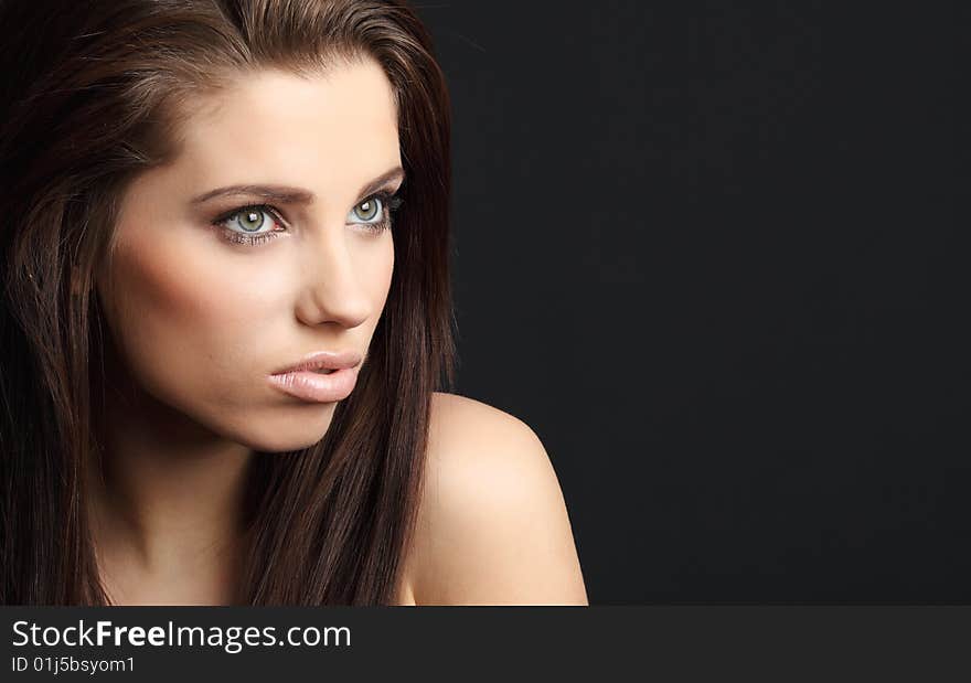 Portrait of beautiful young fashion model. black background. Portrait of beautiful young fashion model. black background.