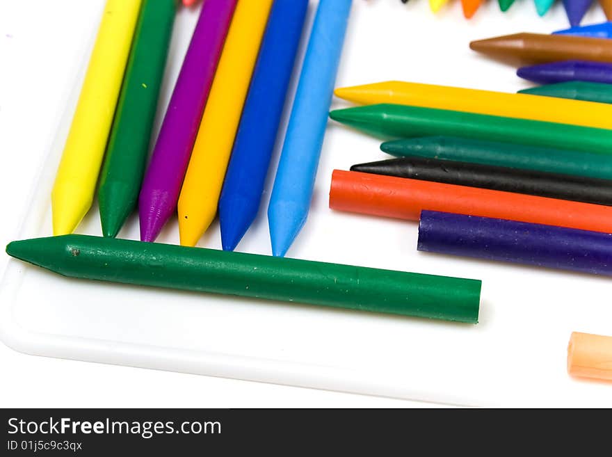 Wax pencils close up on a white background