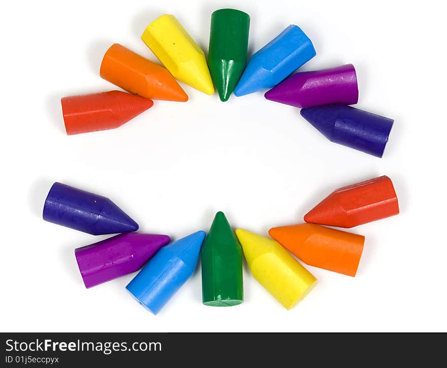 Two semicircles, their made wax crayons of all colors of a rainbow