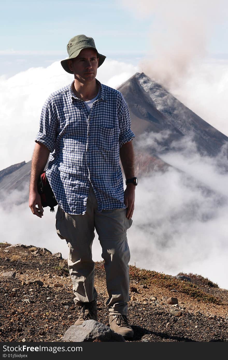 Me on top of Acatenango volcano, in the back the erupting Fuego volvano in Guatemala