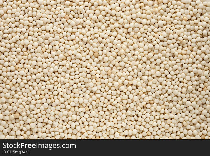 Close view of couscous rounds uncooked. Close view of couscous rounds uncooked.