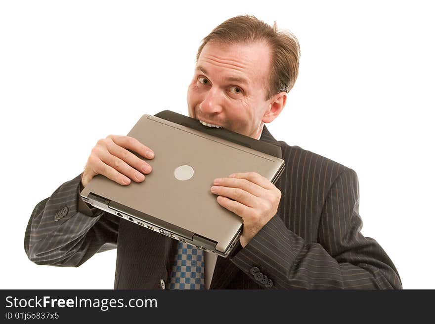 Playful businessman bite off laptop