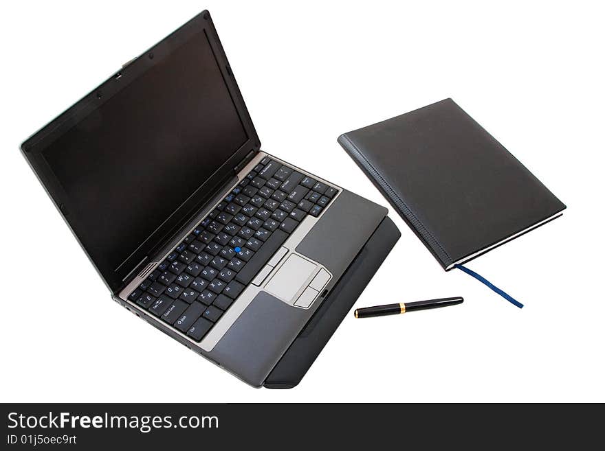 Little laptop, note and pen. Little laptop, note and pen