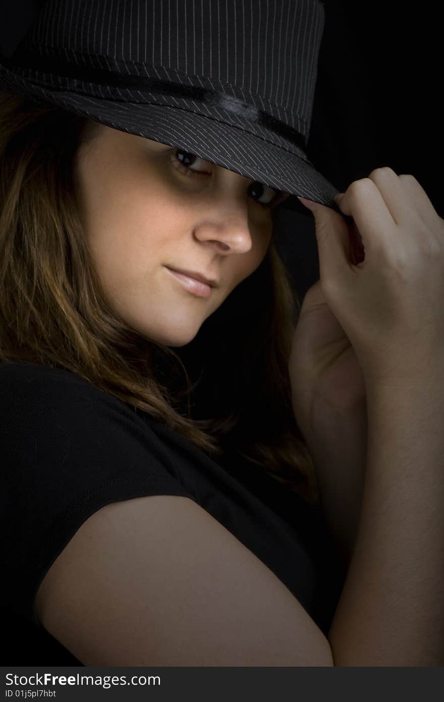 Beautiful brunette woman wearing a black hat. Beautiful brunette woman wearing a black hat.