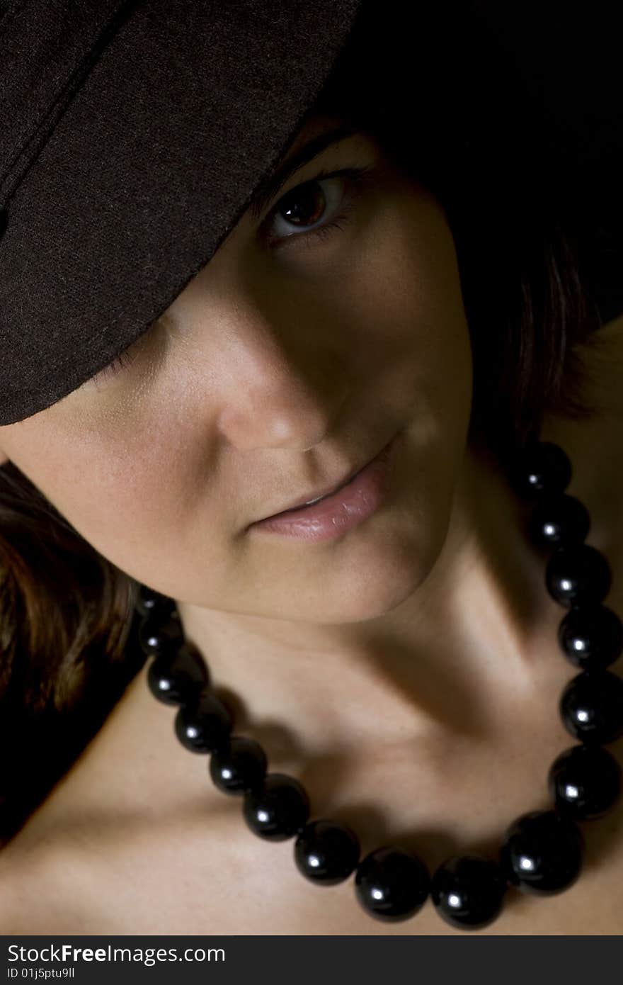 Image of a stunning female model wearing a heavy black necklace.