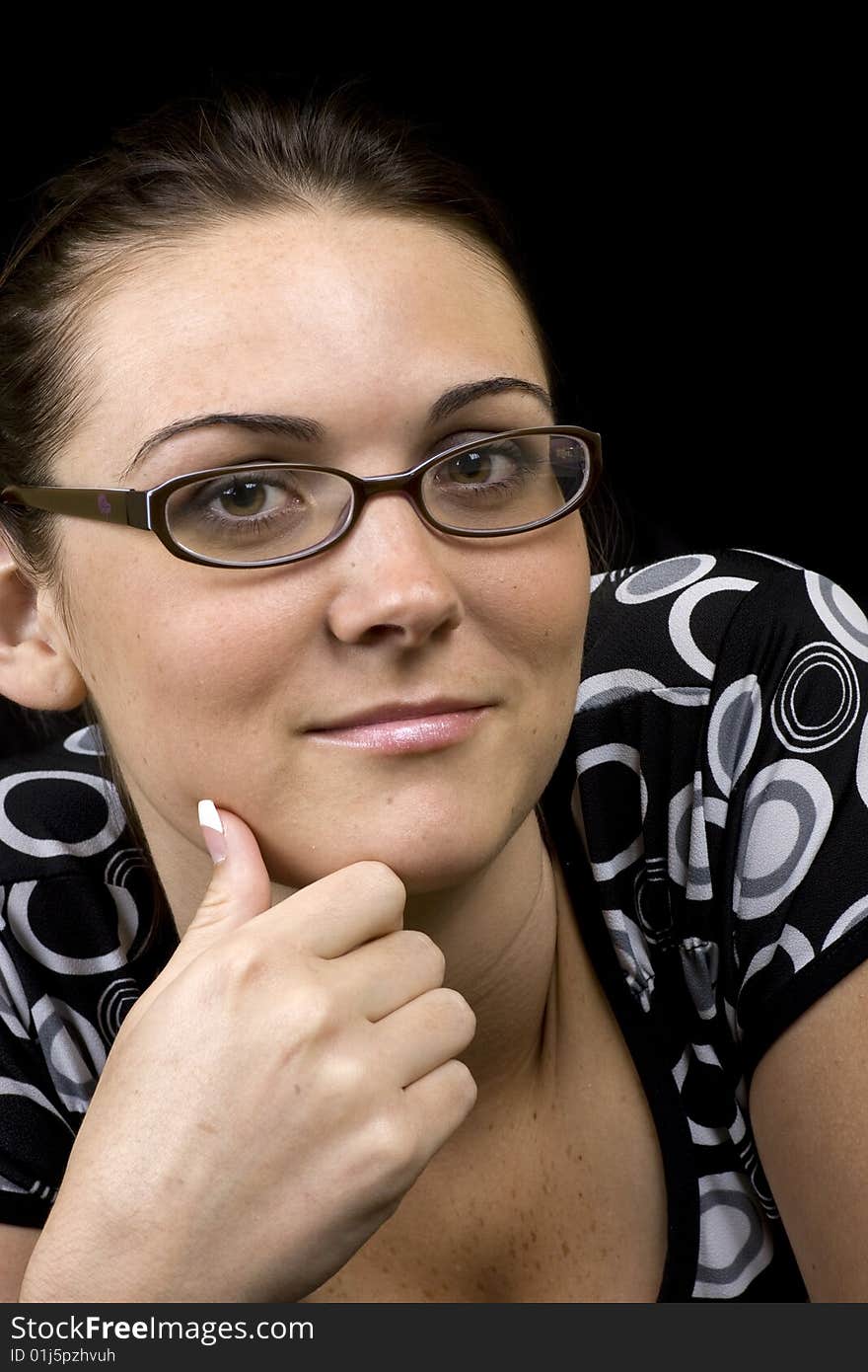 Portrait of a lovely brunette wearing glasses. Portrait of a lovely brunette wearing glasses.