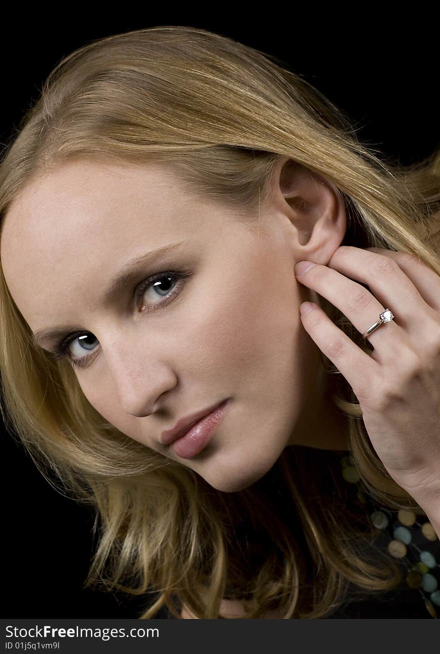 Closeup of a beautiful blonde woman with blue eyes. Closeup of a beautiful blonde woman with blue eyes.