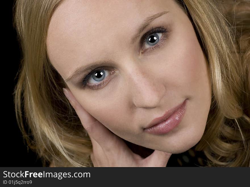 Closeup image of a blonde woman with blue eyes. Closeup image of a blonde woman with blue eyes