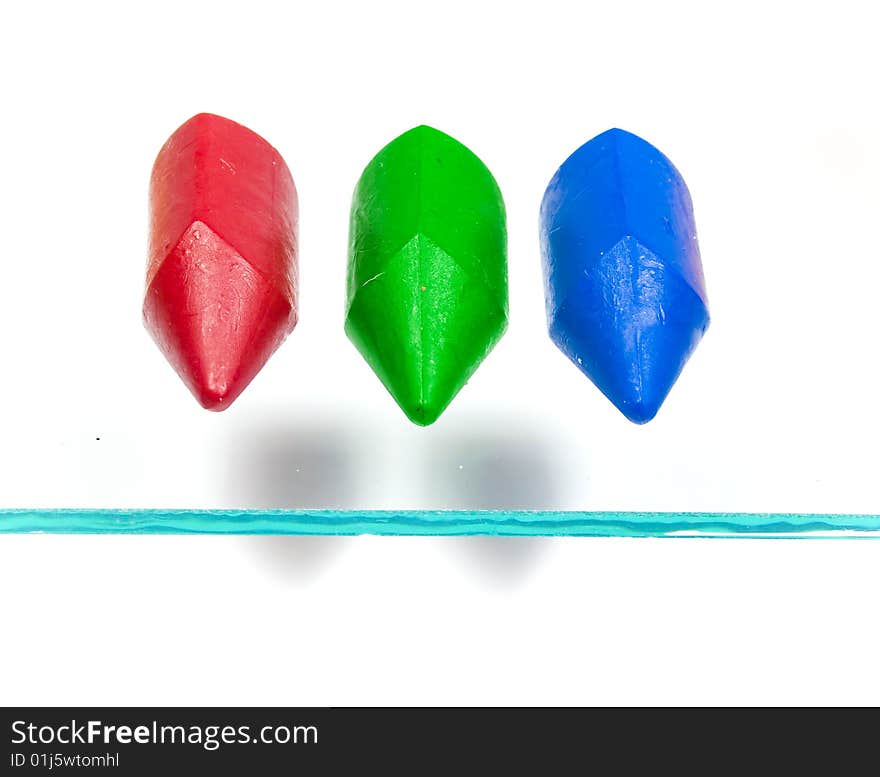 Three children's wax pencils primary colors with two shadows