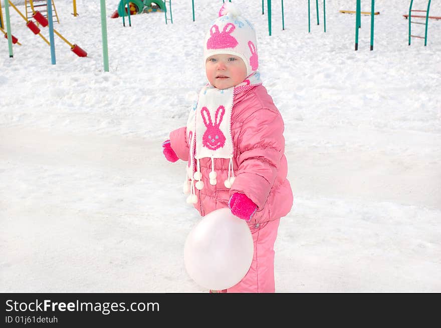 Little Girl On Winter Playground.