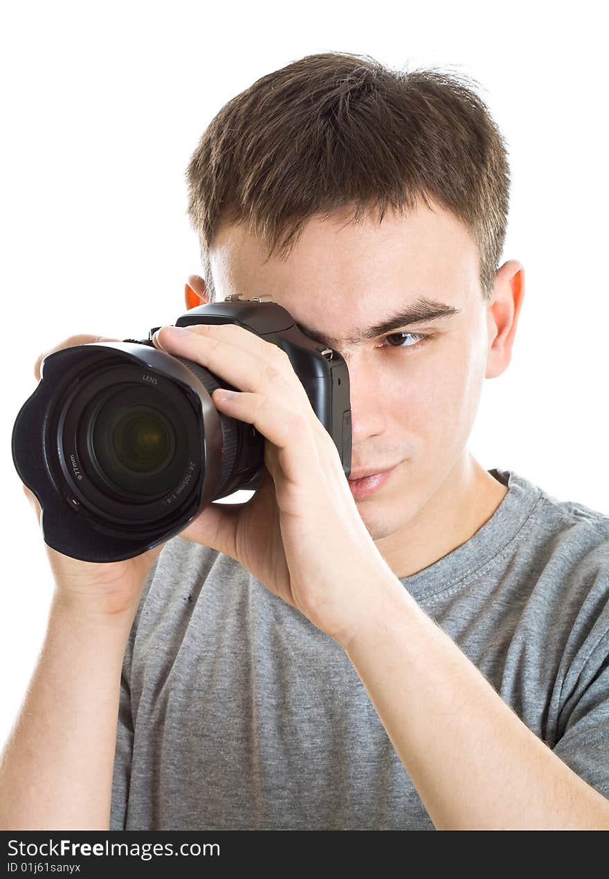 Young photographer with camera. Isolated on white background