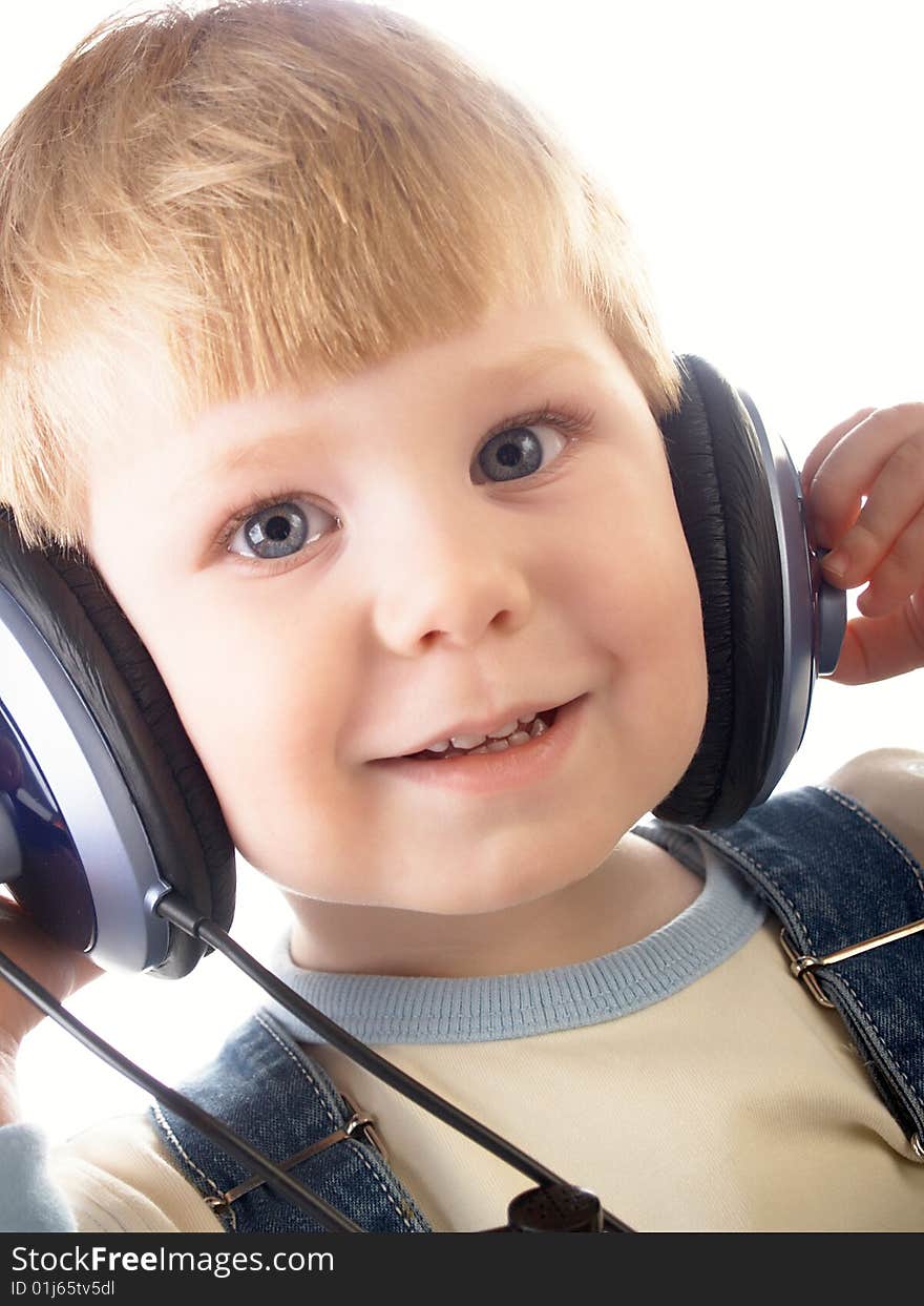 Portrait of the beautiful child in headphones. Portrait of the beautiful child in headphones