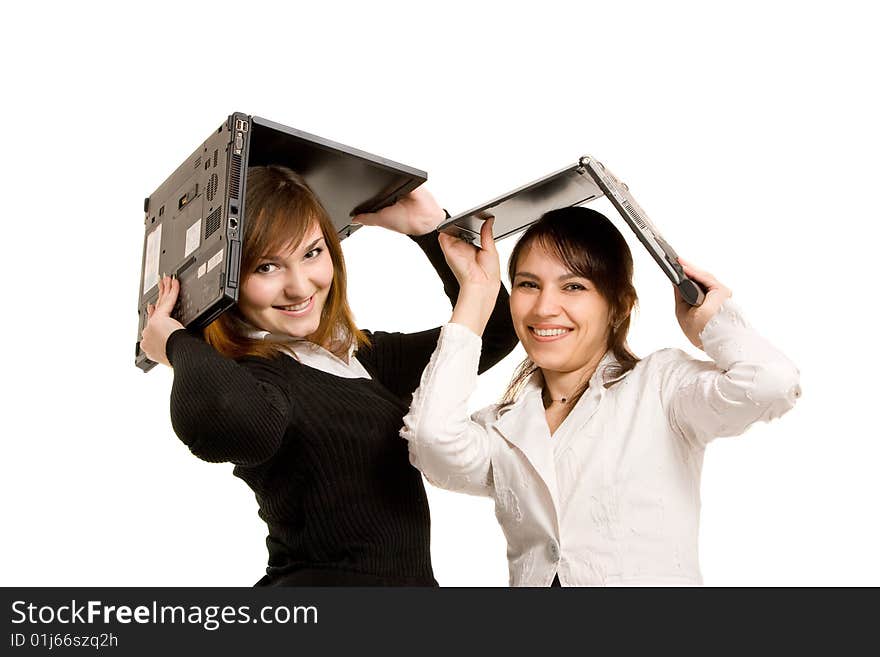 Two young businesswomen and laptop. Two young businesswomen and laptop