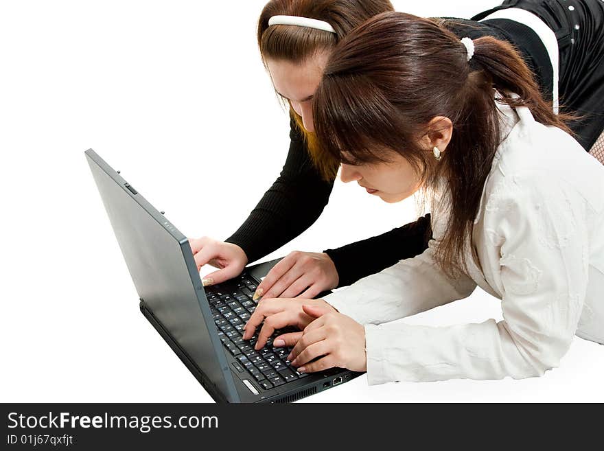 Two women work oh the laptop. Two women work oh the laptop