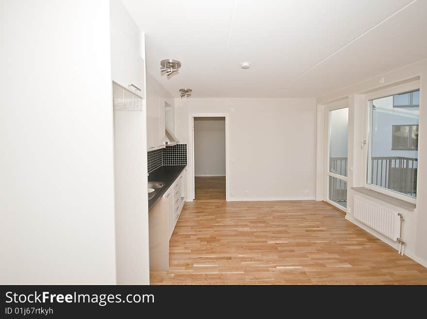 An empty apartment and a kitchen