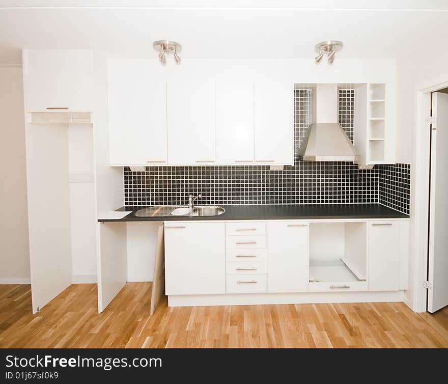 An empty apartment and a kitchen